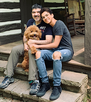 Dr. Enrique Farina with his teen son and dog