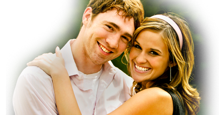 happy young couple smiling and hugging